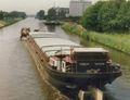 Torrent gesleept door de Deo Volente op het Twentekanaal bij Lochem.