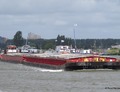 Maasdam & Kreta met de duwboot Phoenix Amsterdamsebrug.
